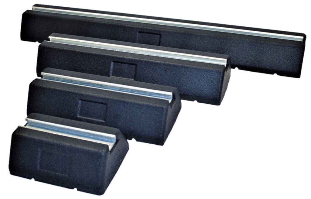 Four black rubber car roof rack blocks