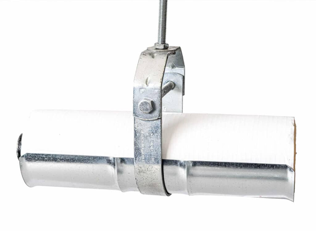 Metal pipe clamp holding paper roll securely