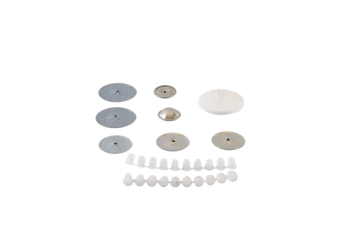 Assorted circular discs and white oval pieces on black background